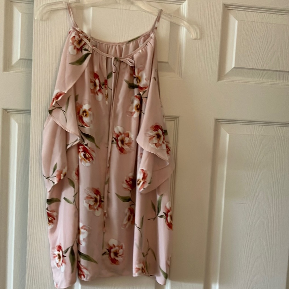 Soft pink floral top may be worn as cold shoulder.